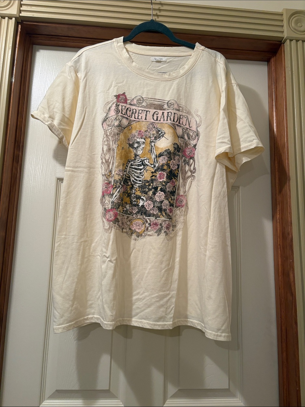 Maurices Cream Short Sleeve Tee with Floral Skeleton Graphic and Pink Accents